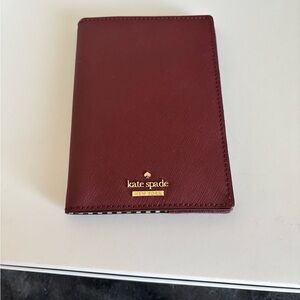 kate spade burgundy leather passport cover with gold logo